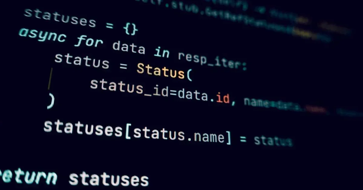 Close-up of Python code on a dark screen showing an async for loop that builds a statuses dictionary and returns it.