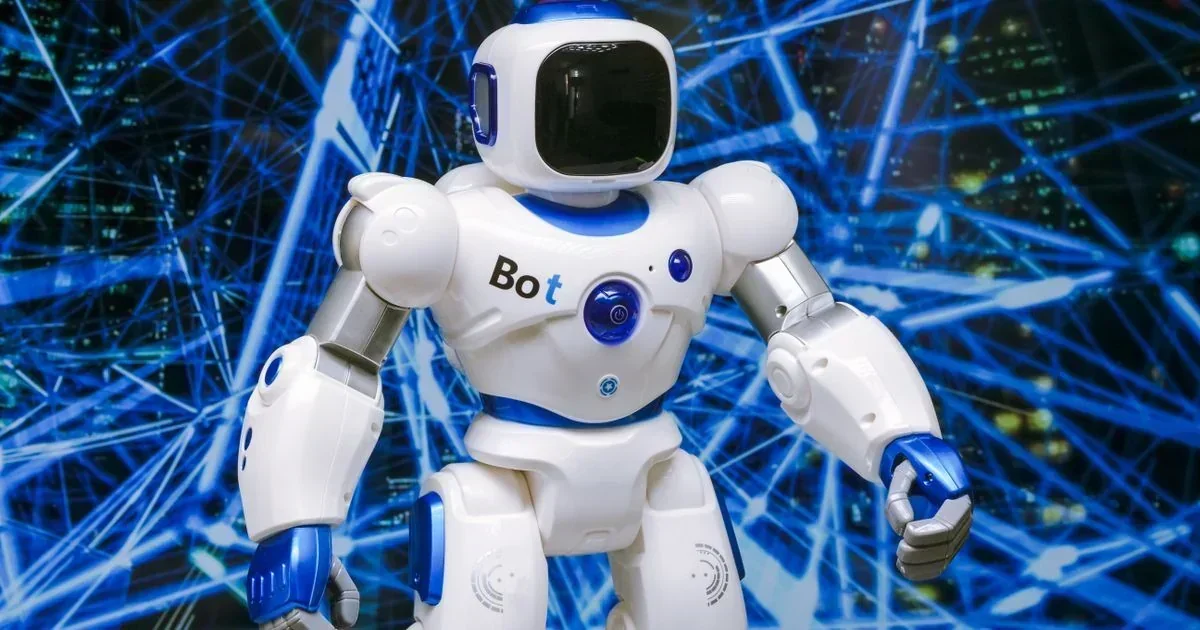 White and blue humanoid robot with "Bot" on its chest and a black visor face stands against a blue digital network background.